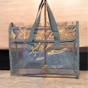 Brand new. Transparent, very thick and durable Tote with Blue Trim